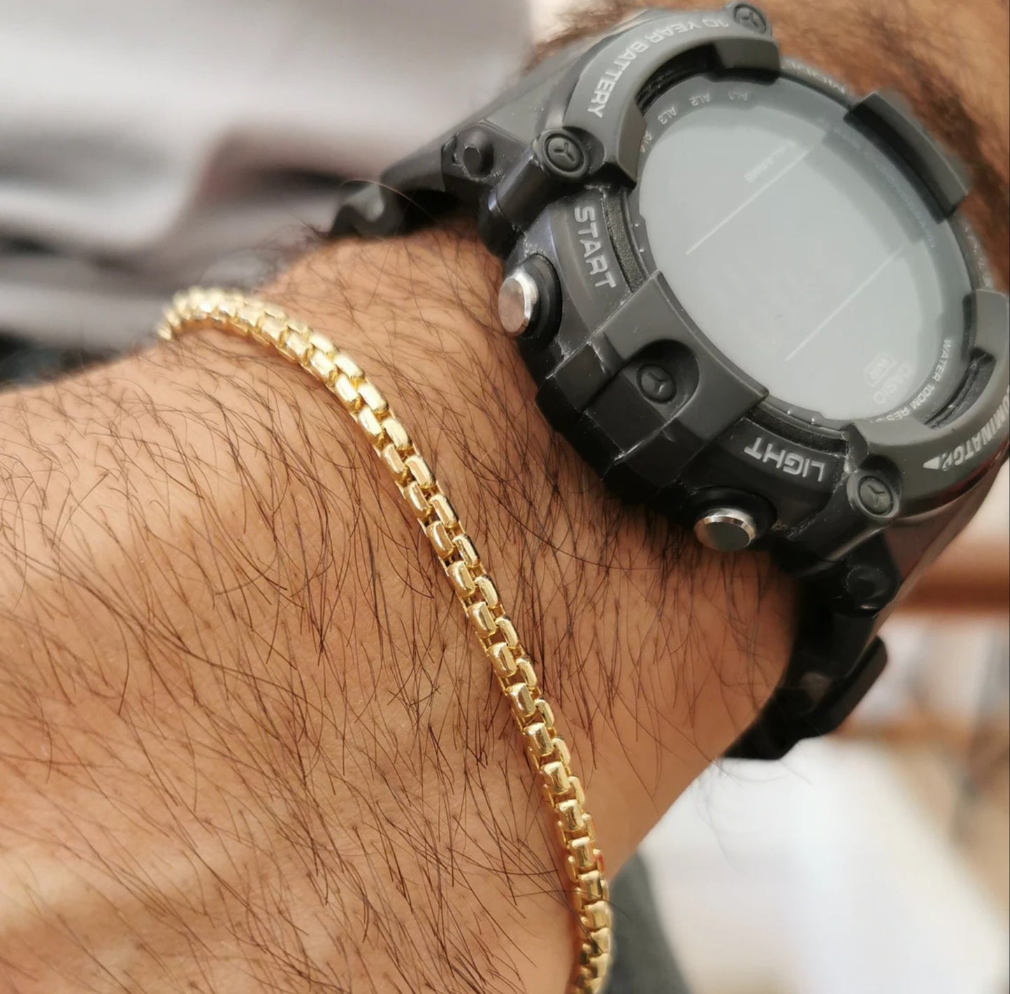 Valentino-Armband mit goldenen Gliedern für Herren